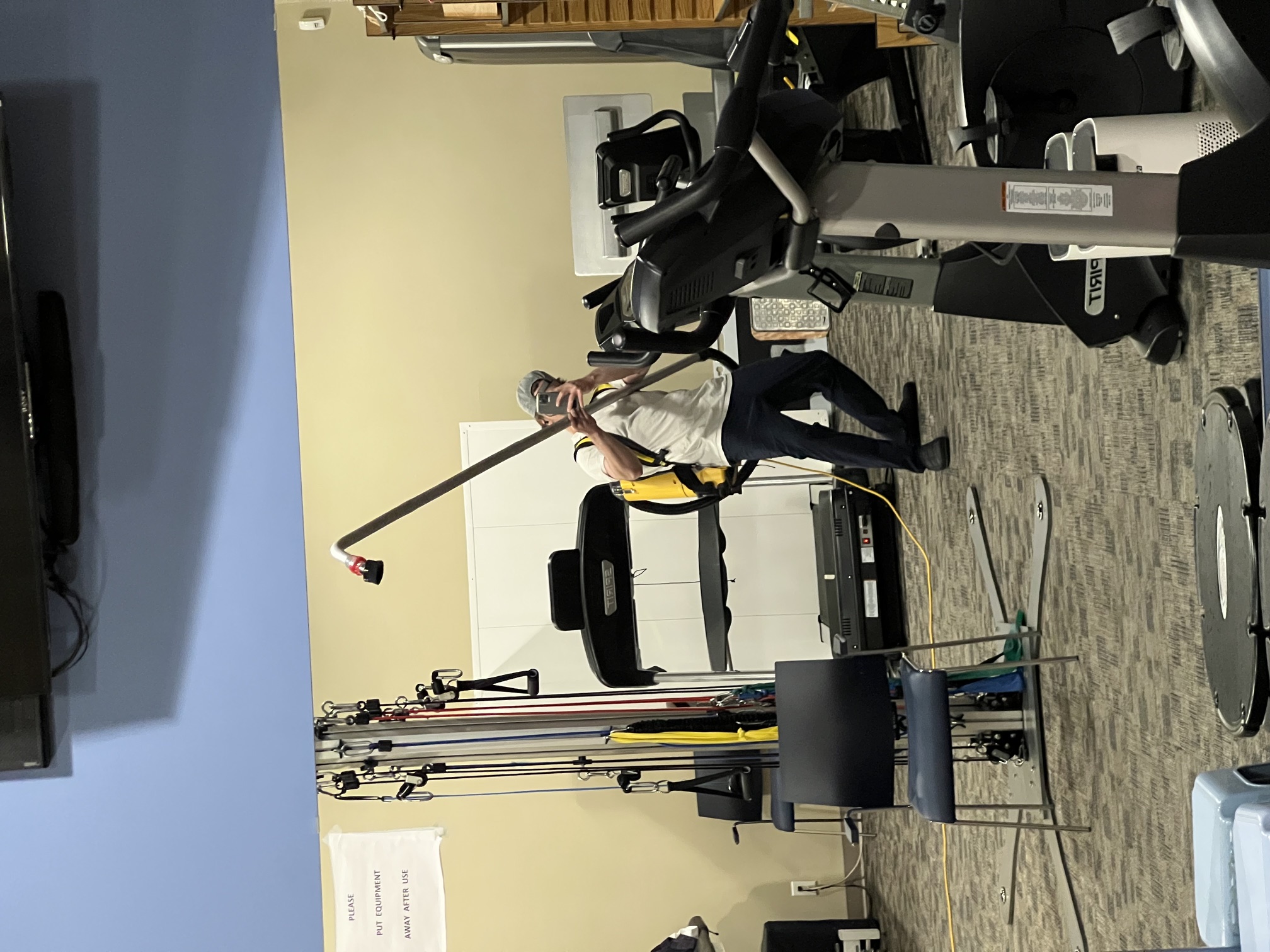 High-reach vacuuming in a Kelowna gym facility